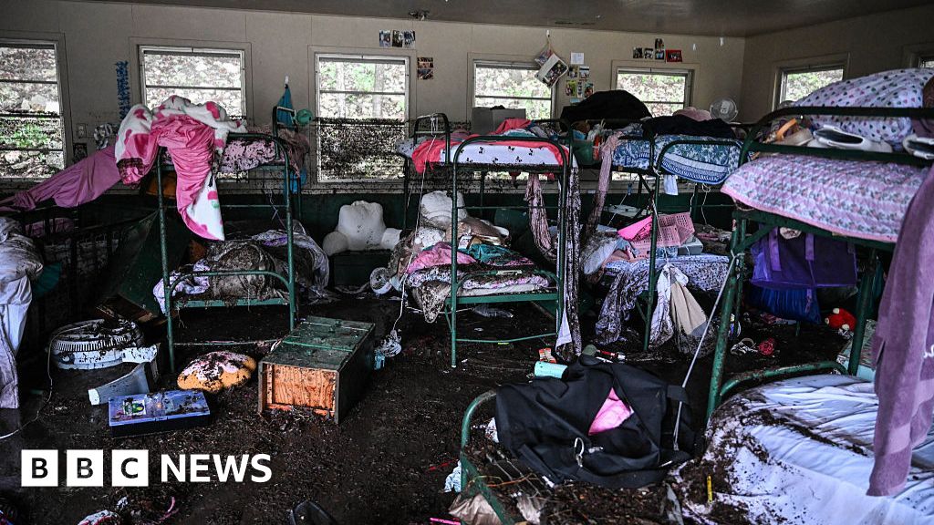 Frantic search for survivors of deluge that killed 32, including 14 children