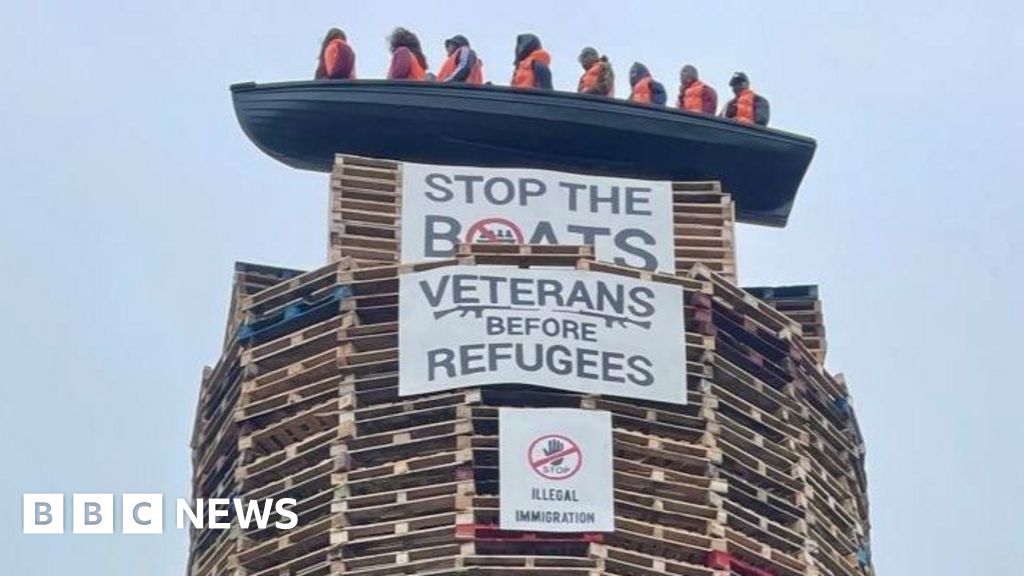 Parties condemn bonfire effigy of refugees in small boat Parties condemn bonfire effigy of refugees in small boat