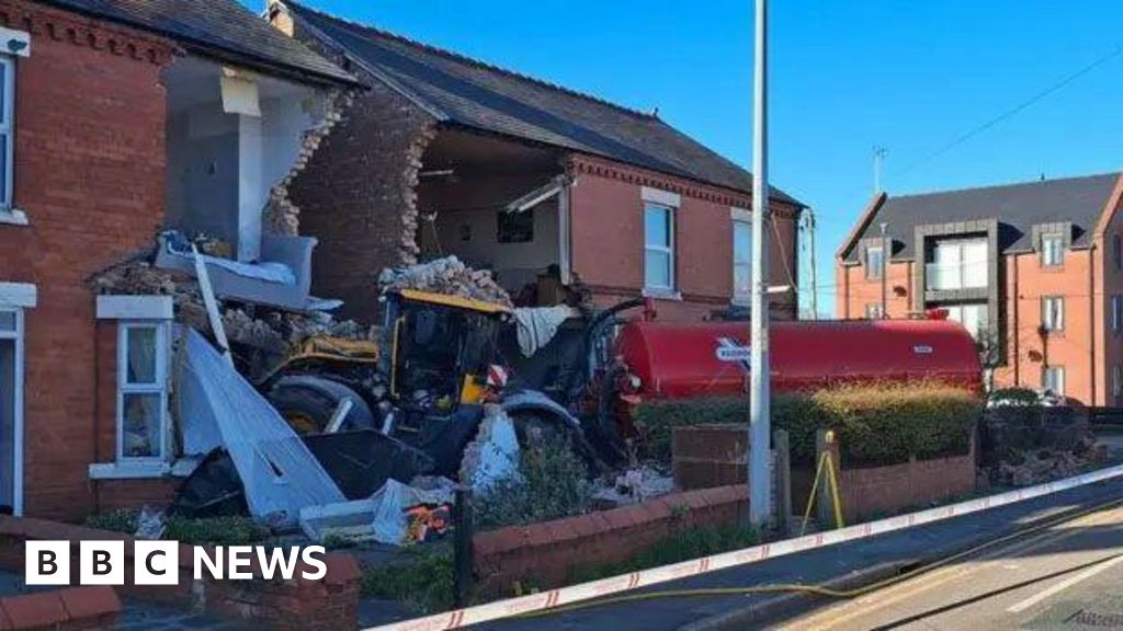 Moment tractor swerves off road and ploughs into homes