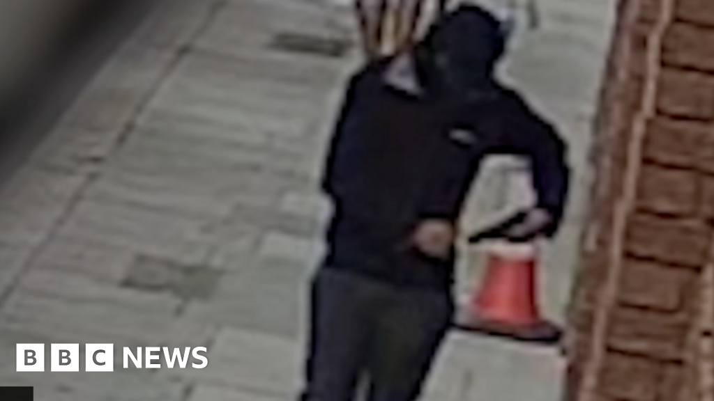 Man with gun caught on CCTV in London street