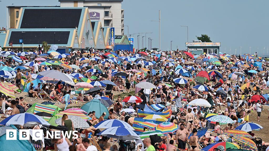 Health alerts and hosepipe bans as UK heatwave temperatures reach 34.7C