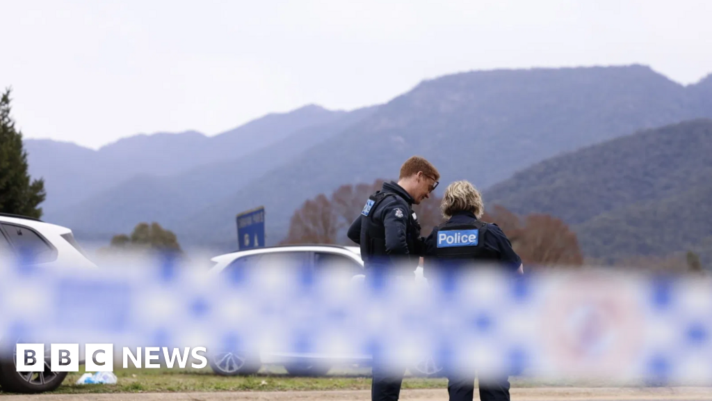 Australia police shooting suspect named as manhunt continues
