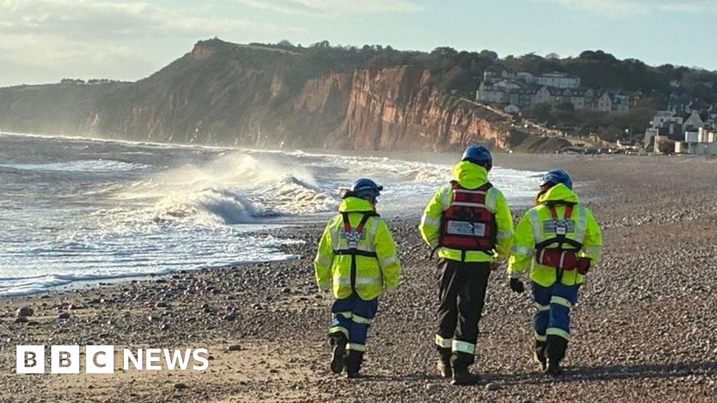 Search for two men missing after Christmas Day swim called off