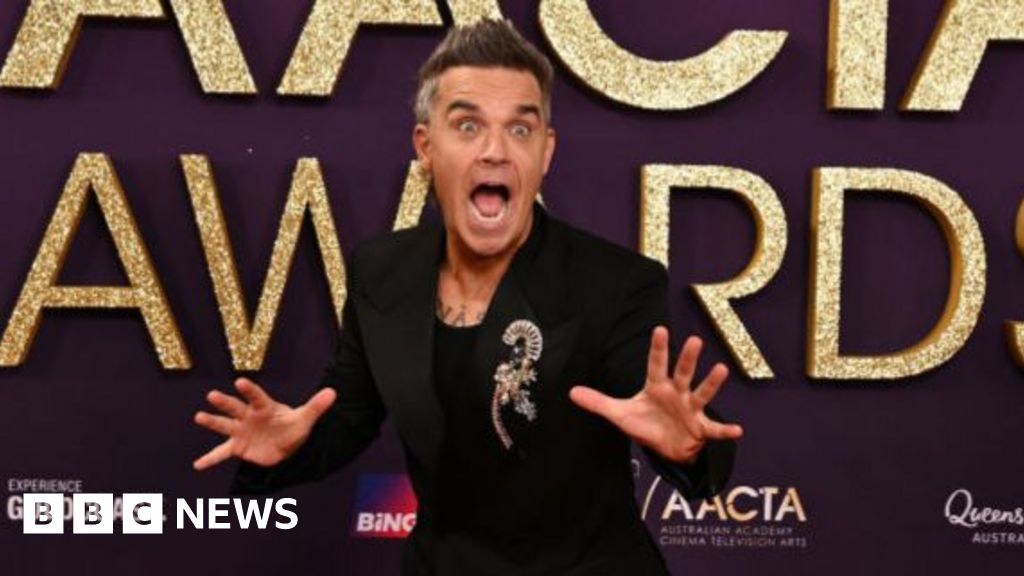 Singer Robbie Williams surprises 94-year-old Grimsby fan